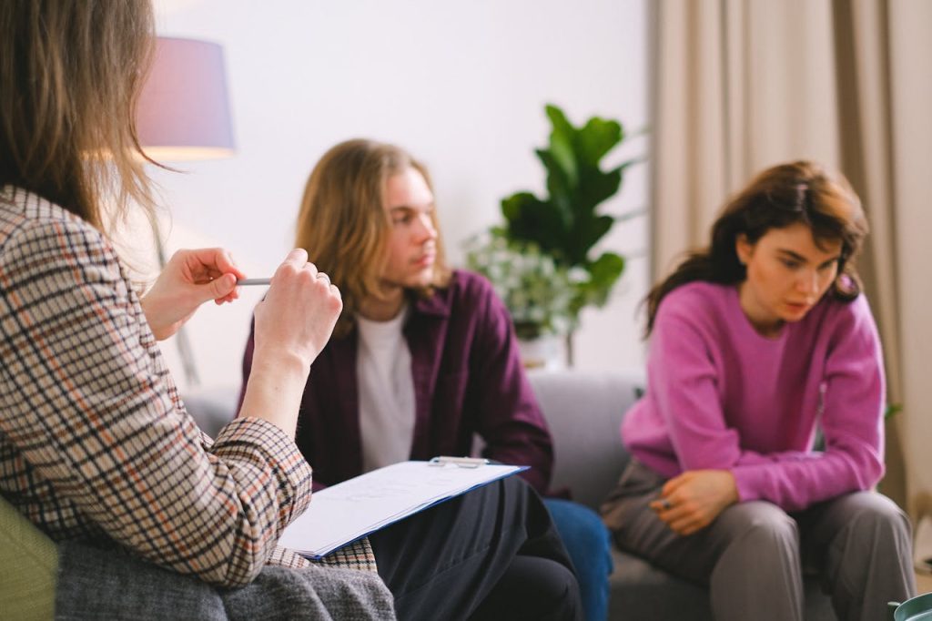 A couple receiving professional therapy in a calming indoor setting.