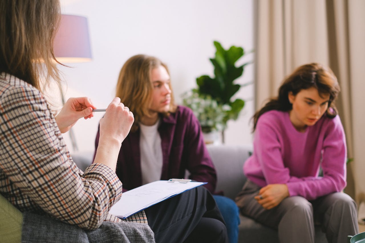 A couple receiving professional therapy in a calming indoor setting.